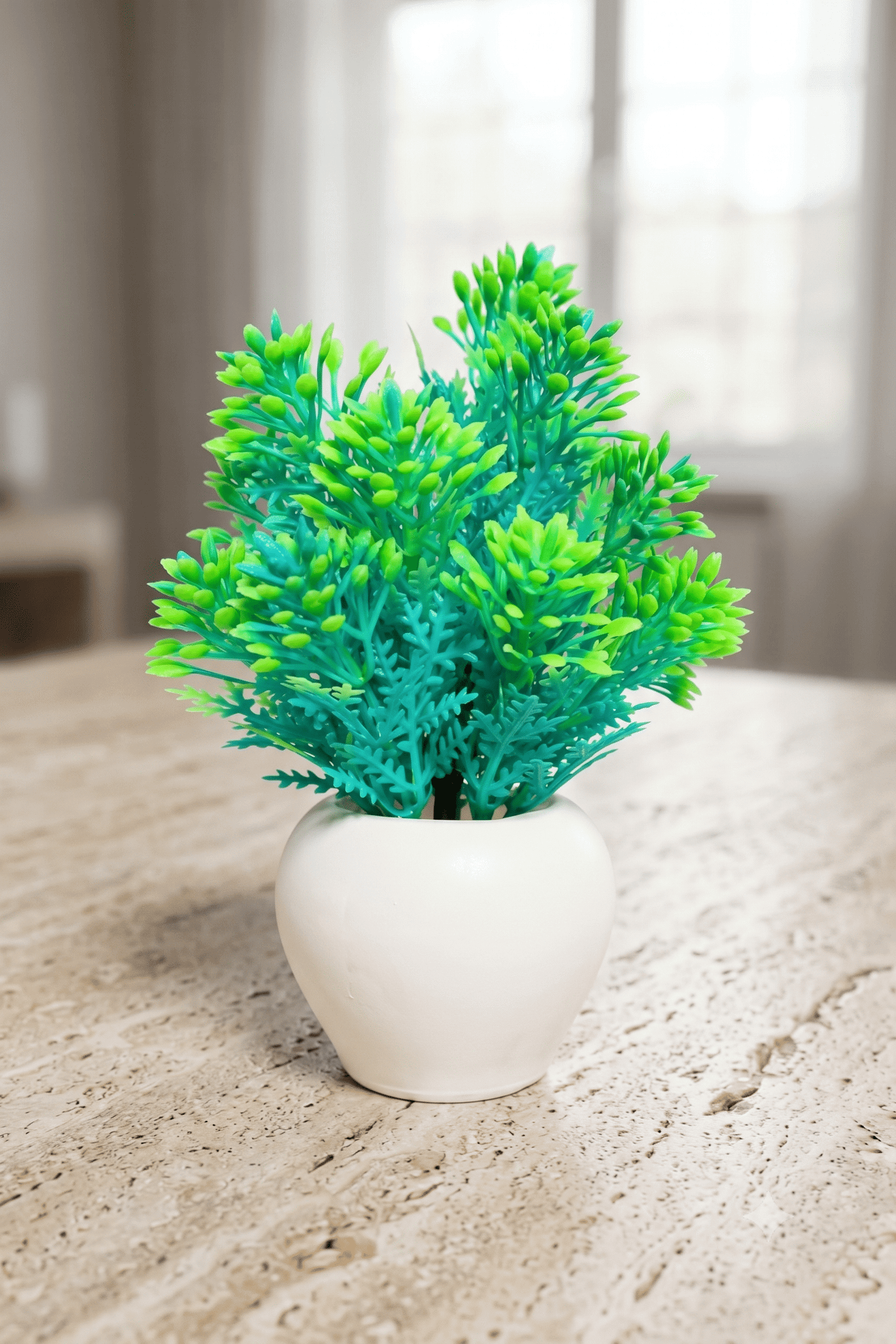 artificial wild green plant with apple shaped white pot